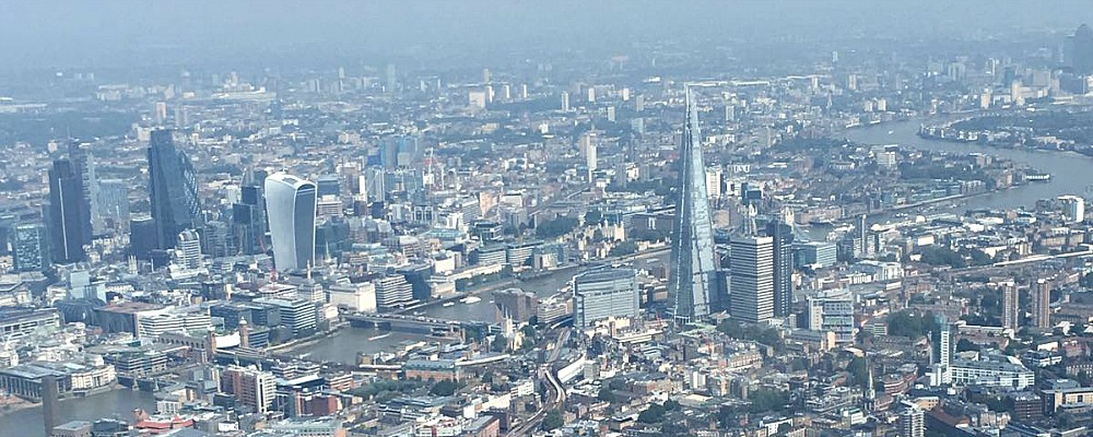 Heading towards The Shard, helicopter view over London