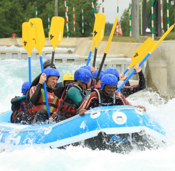 White water rafting and kayaking along a river