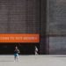 Man in front of the Tate Modern entrance