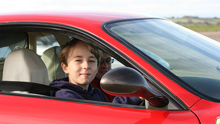 junior driving in a car