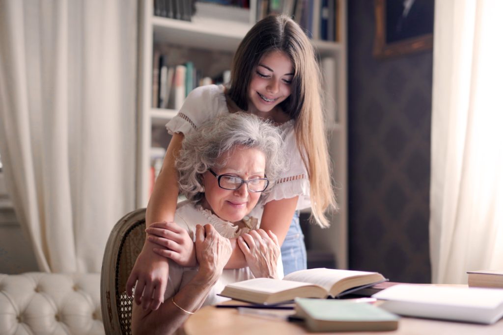 Grandmother and granddaughter hugging