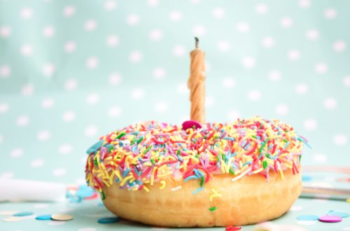 donut with a birthday candle in the middle