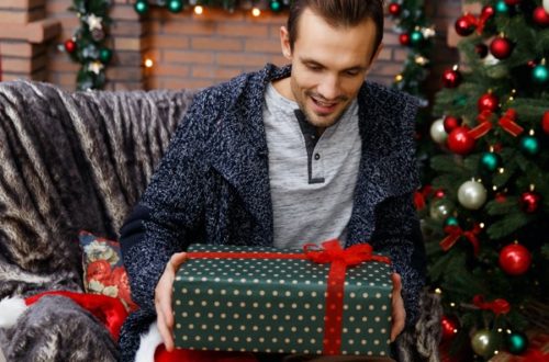 man opening christmas present
