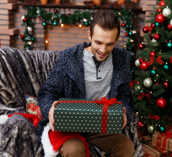 man opening christmas present