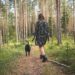 lady and a dog on a woodland walk