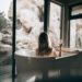 Women enjoying a glass of wine in a luxury bath